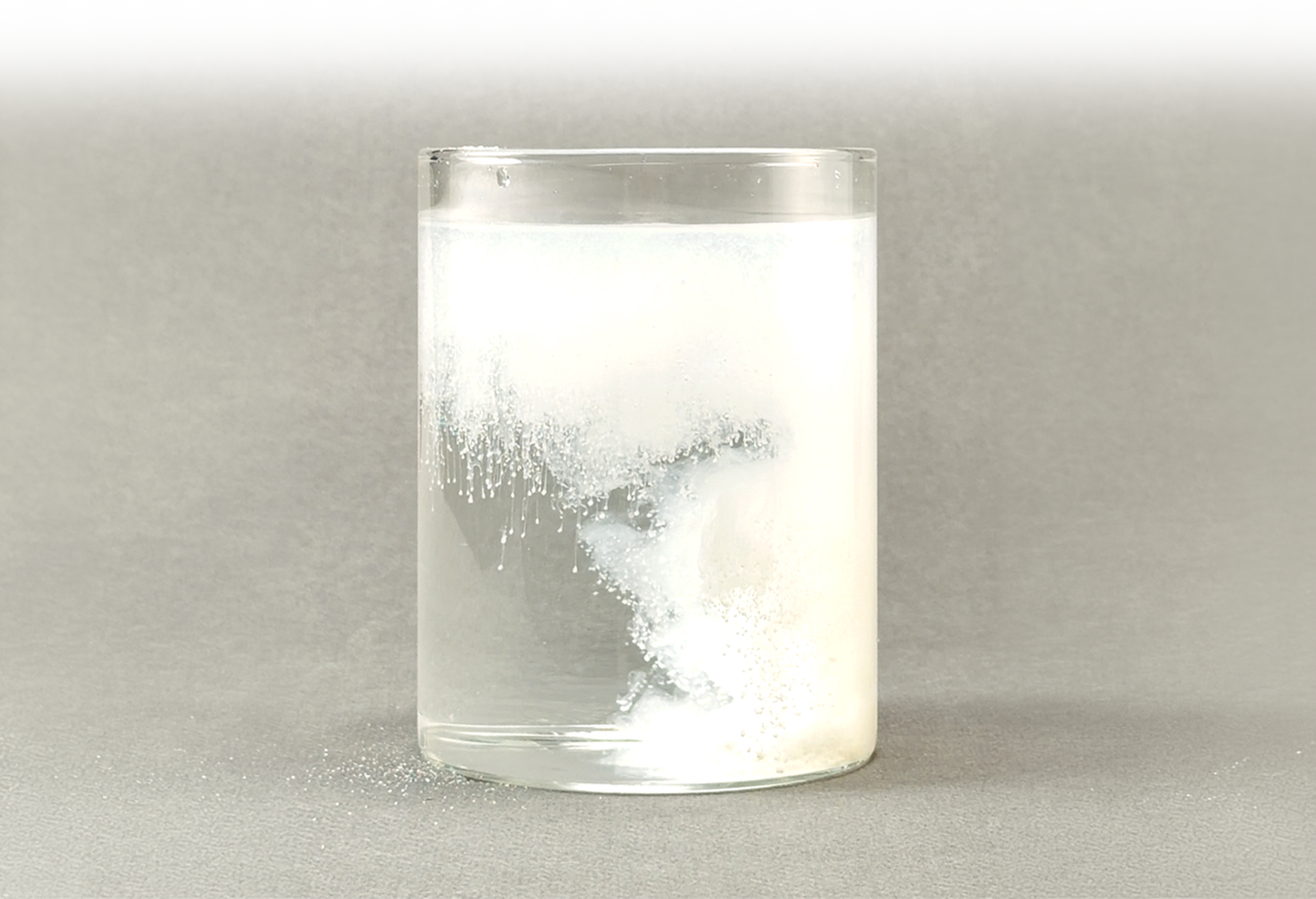 Infant formula powder dissolving in water to demonstrate easy mixing and solubility